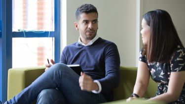 Two academics sat down having a conversation
