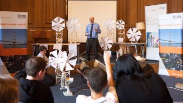 An engineering lecturer presents to schoolchildren.