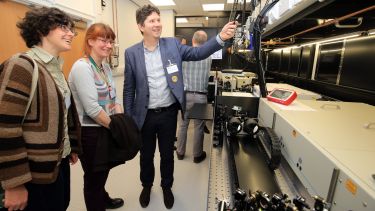 Dr Dimitri Chekulaev shows guests around the new Lord Porter Ultrafast Laser Spectroscopy Laboratory