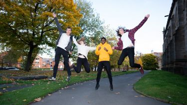 Students jumping outside St Georges lecture theatre