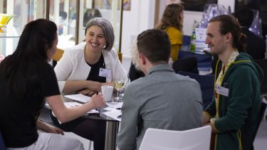 Alumni and students at a speed networking event