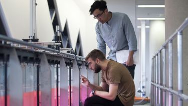 Two civil engineering students in the fluid dynamics lab