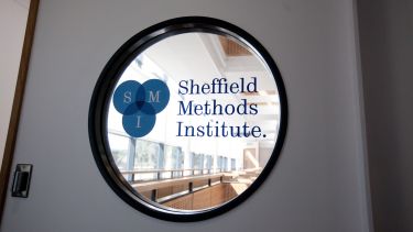 window in a wall with the SMI logo