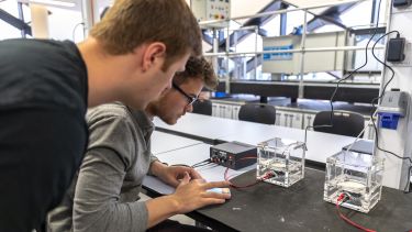 Two male students in the Diamond electronics lab