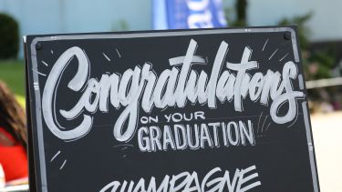 A congratulations sign outside the Student Union at graduation.