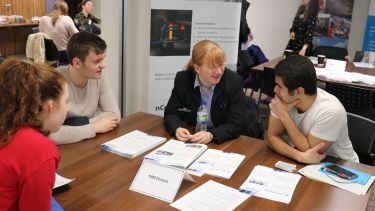 Students talking to an employer at a careers event