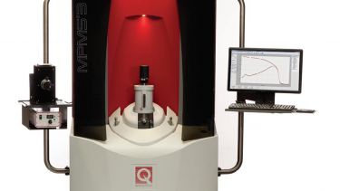 The black, red, and white magnetometer, with control panel viewing screen alongside