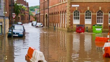 Flooding in Sheffield in 2007. Cars are partially underwater.  