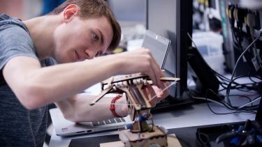 ACSE student working on a mechatronic project