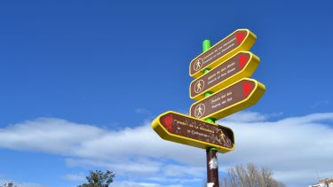 A signpost with English and Spanish writing