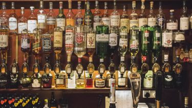 Lots of different types of alcohol in a bar in Scotland. 