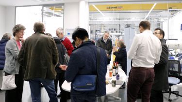 A group of people networking at the Royce Translational Centre