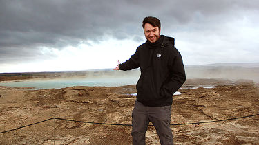 Adam Harris stood by a lagoon.