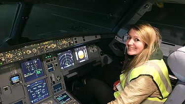 Josie sat in a cockpit.