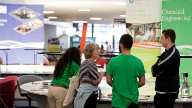 A parent in discussion with student ambassadors at an open day in The Diamond. 