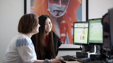 Two students working at a computer