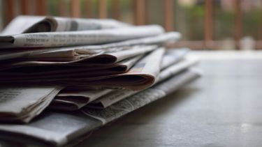 A pile of newspapers. 