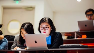 A postgraduate student in a lecture