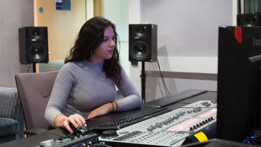 Women operating sound desk