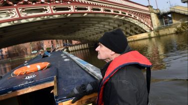 Man on a canal boat