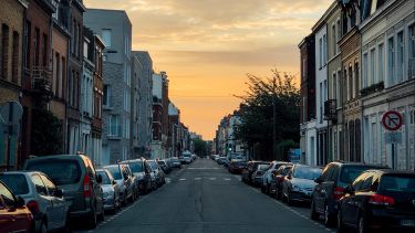 Cars parked on an empty street