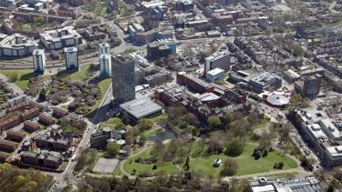 Aerial view of hexagonal Geography and Planning, green Weston Park and the Arts Tower