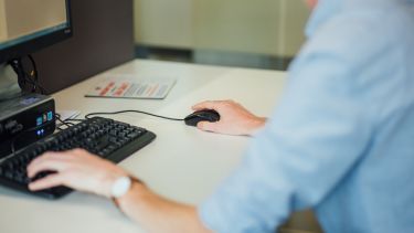 A man is working on a computer