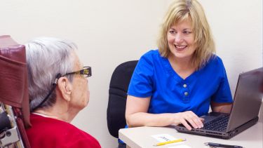 A speech therapist with a patient