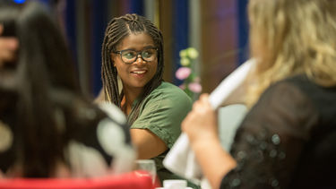 International Development graduate at a celebratory dinner