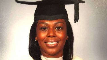 A photo of Jade Powell-Thomas at their graduation - image