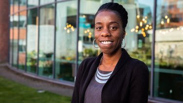 A photo of Jesrine Clarke-Darrington stood outside the Students' Union - image