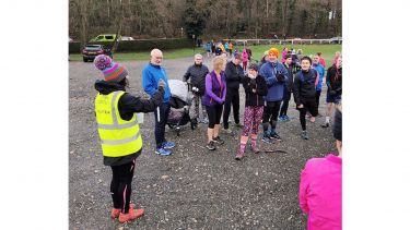 A group of runners gathered together before the race - image