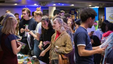 Students at a stall at the activities fair during intro week at the University of Sheffield