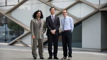 Photo of Matthew Malek, Prof Takaaki Kajita and Prof Nigel Clarke stood outside the Diamond