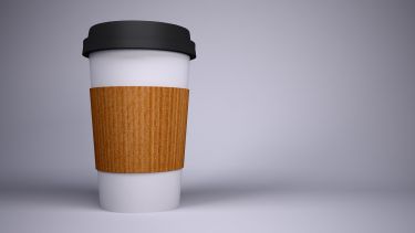 Coffee cup on plain background