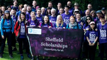 Participants from the Big Walk posing for a photograph to promote their fundraising activity for Sheffield scholarships. 
