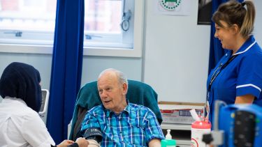 Nursing student with patient