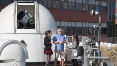 Students with the University of Sheffield's rooftop telescopes