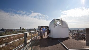 Students with the University of Sheffield's rooftop telescopes