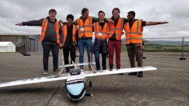 Members of the Volaticus project team on an airfield