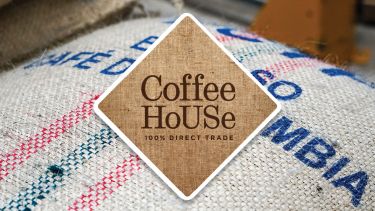 Coffe HoUSe: 100% direct trade (Logo over photograph of coffee beans)
