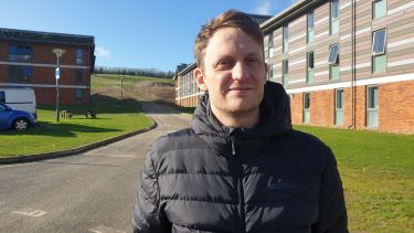 Ben Lewis standing on road