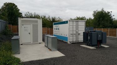 Installation of flywheels in shipping containers at the Willenhall site.