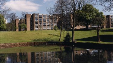 Earnshaw Hall of residence with the pond in the foreground