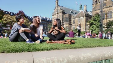 Students sitting in Peace Gardens