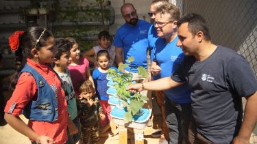 Scientists from the Desert Garden team with children from the Za'atari refugee camp