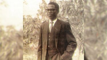 Black and white photo of Samuel Gbadegeshin Laosebikan in a suit