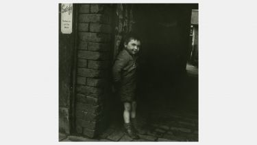 A boy on the street on 1950s Coventry