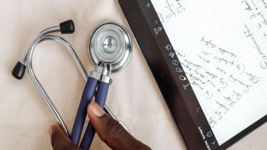A stethoscope and an iPad with data