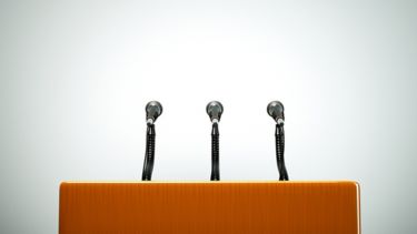 Conference podium with three microphones